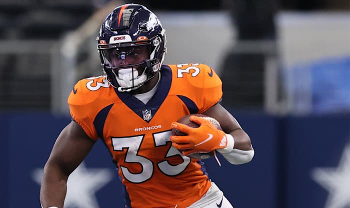 Denver Broncos running back Javonte Williams (33) runs with the ball in the second quarter against the Dallas Cowboys at AT&T Stadium.